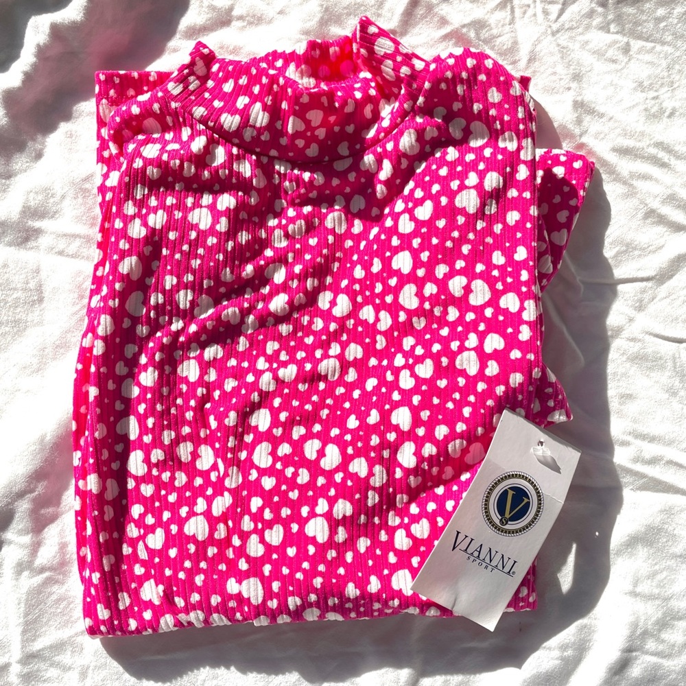 Pink turtle neck and long sleeve shirt with white Heart shapes 💓